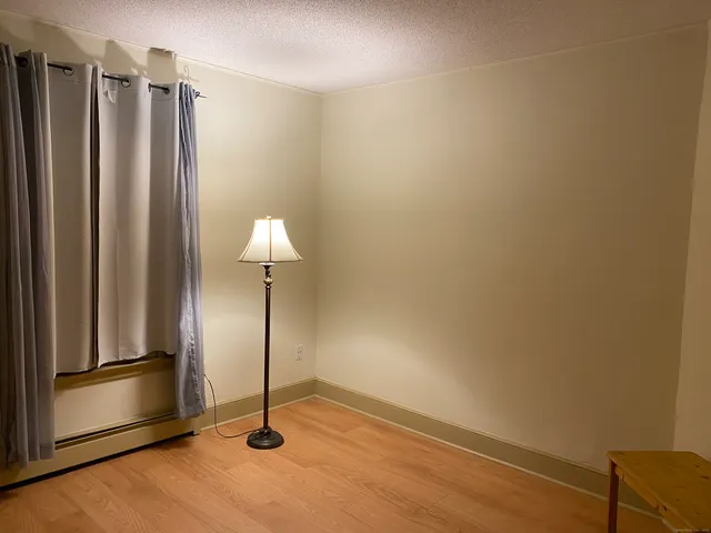 a view of a livingroom with wooden floor