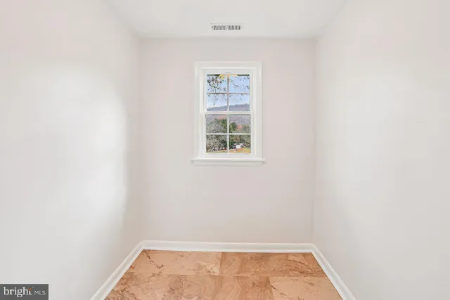 a view of a small space with racks on the wall