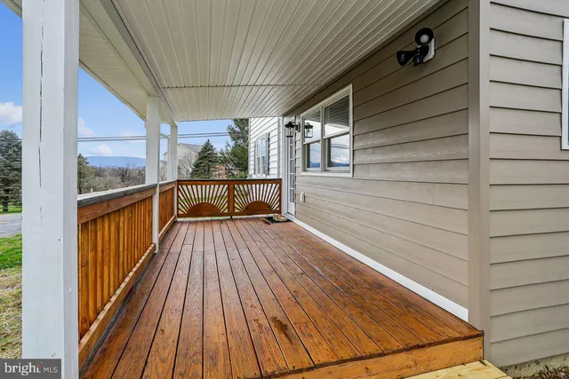 a view of balcony with wooden floor