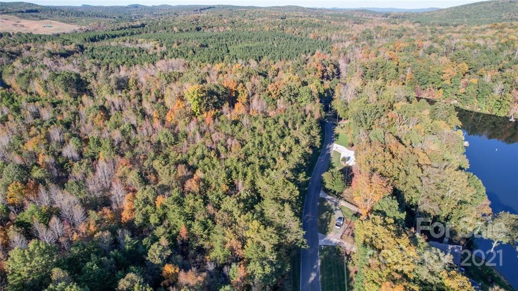 456 Shamrock Road New London, NC 28127 - Photo 5 of 10 a view of a city with lush green forest