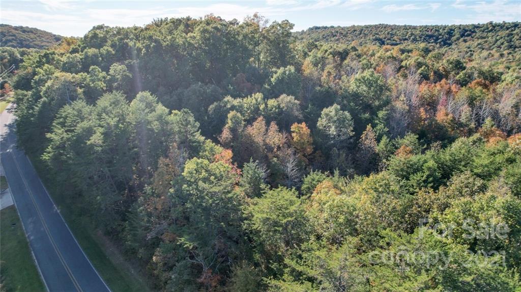 456 Shamrock Road New London, NC 28127 - Photo 10 of 10 a view of a lake with a mountain
