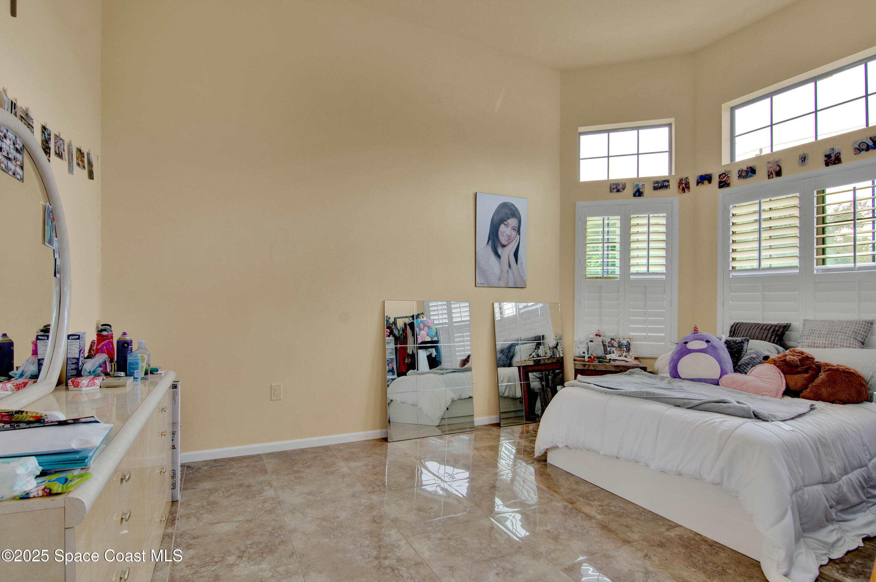 900 Hall Road Malabar, FL 32950 - Photo 19 of 28 a bedroom with a bed and window