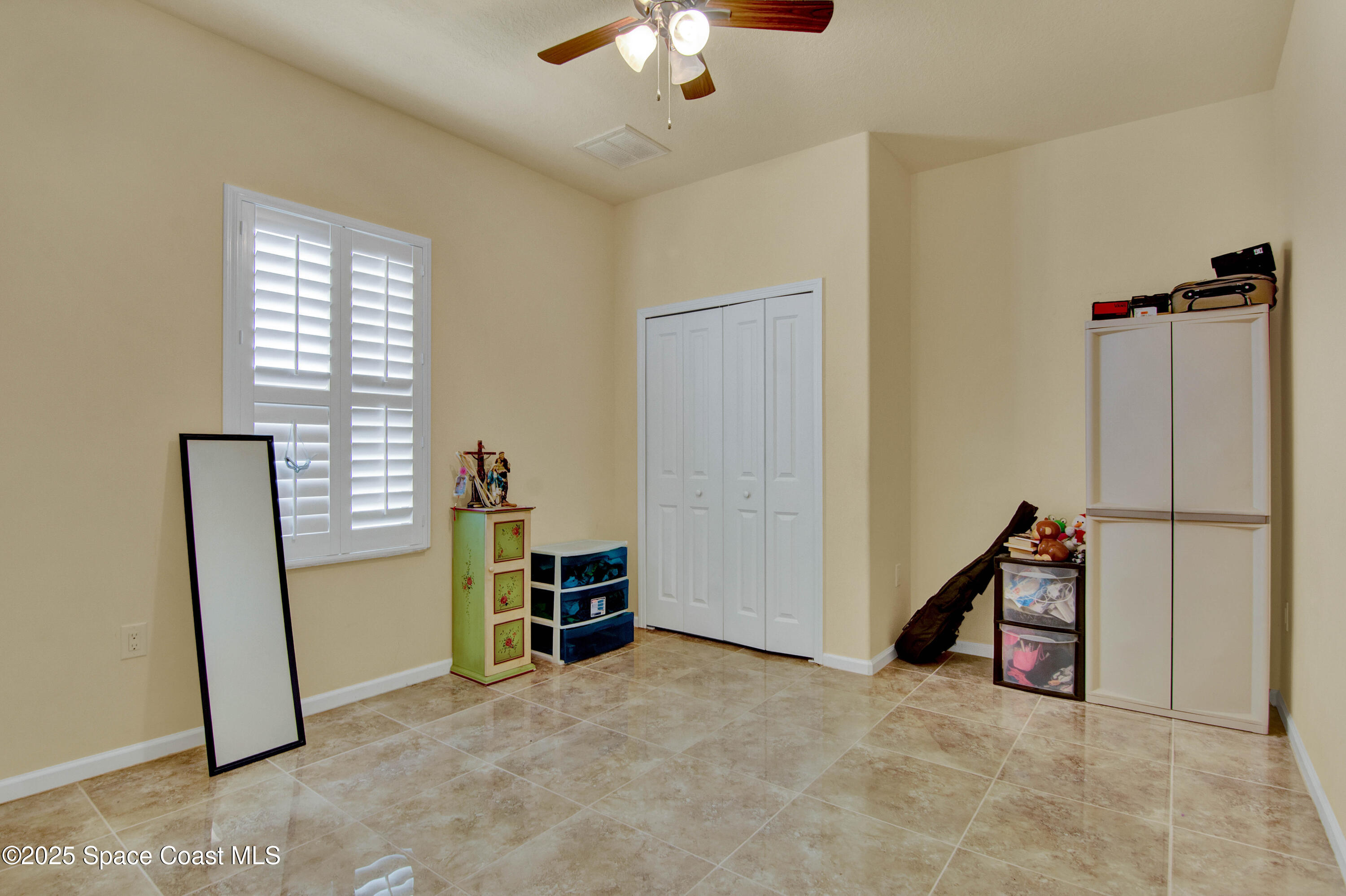 900 Hall Road Malabar, FL 32950 - Photo 20 of 28 a view of a livingroom with furniture and a ceiling fan