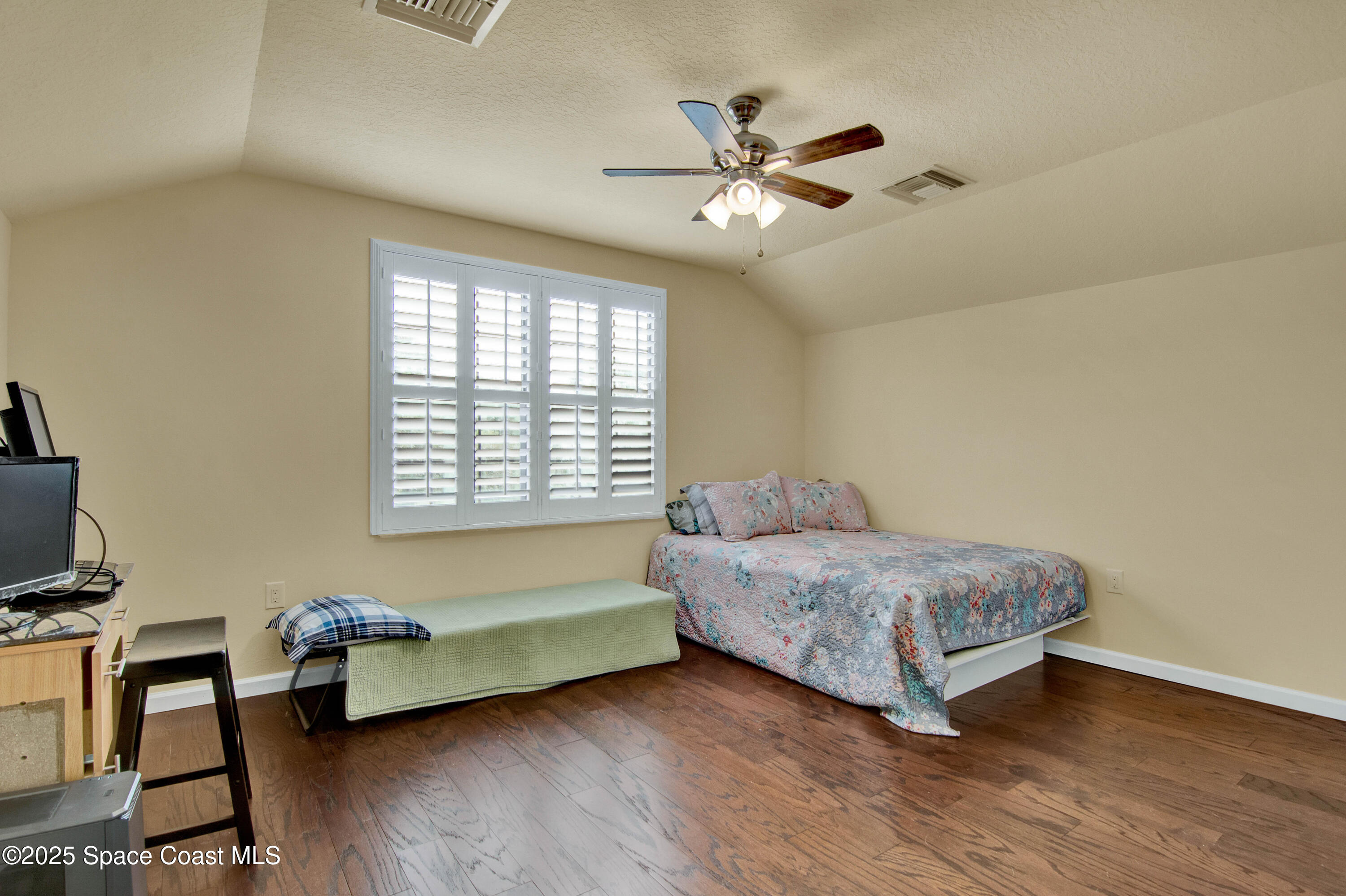 900 Hall Road Malabar, FL 32950 - Photo 23 of 28 a bedroom with a bed and a window