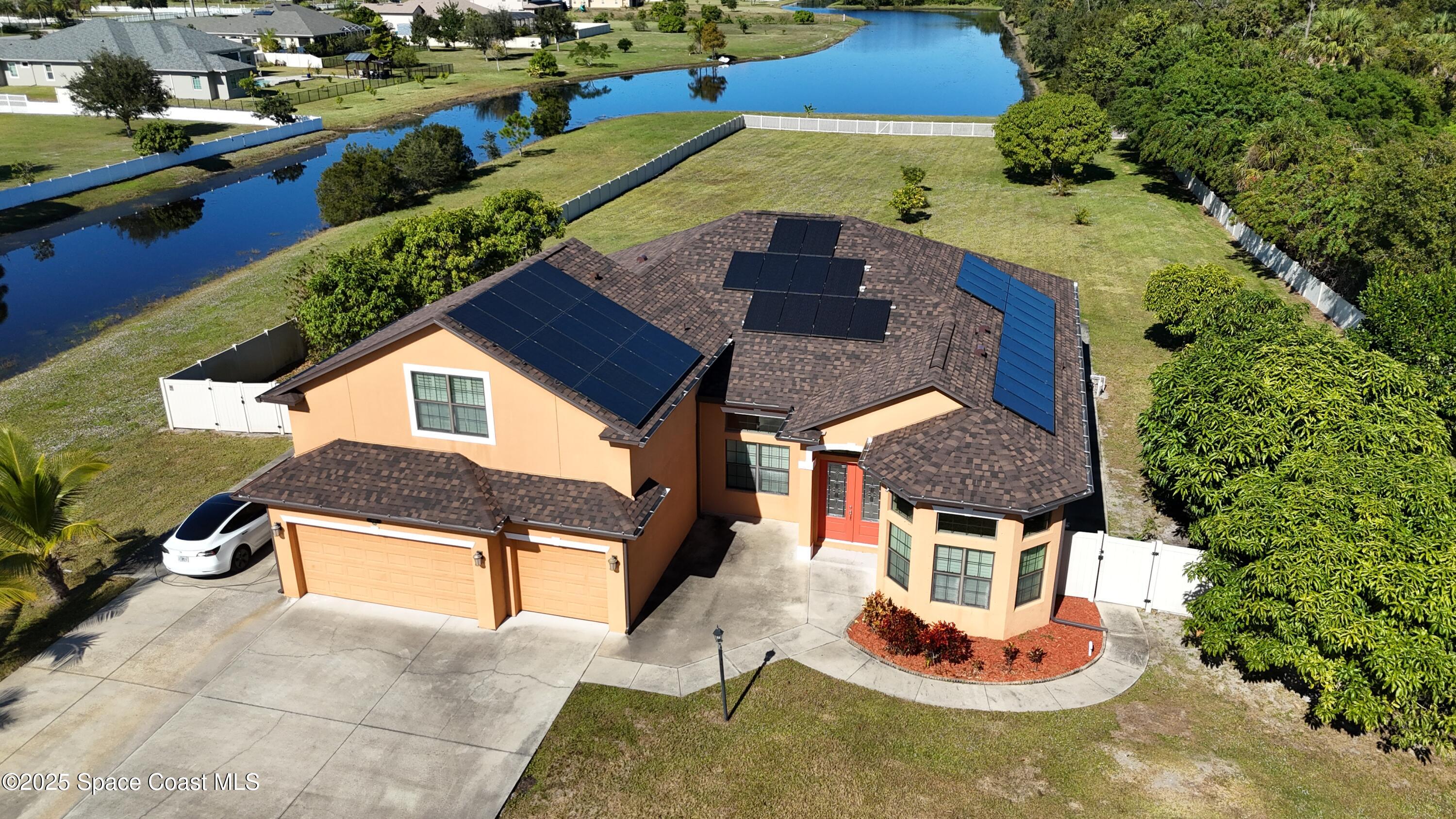 900 Hall Road Malabar, FL 32950 - Photo 25 of 28 an aerial view of a house with yard swimming pool and outdoor seating