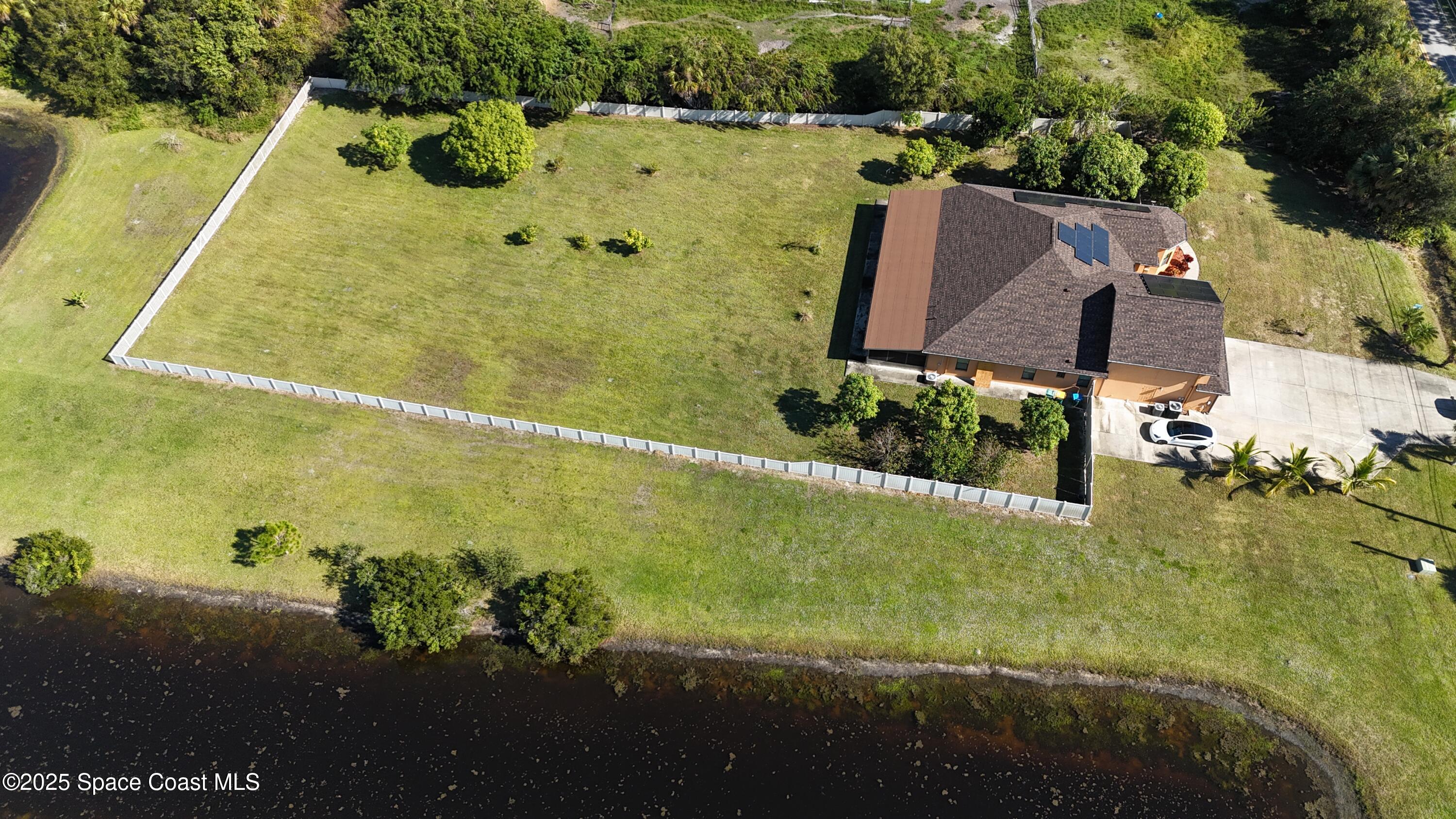 900 Hall Road Malabar, FL 32950 - Photo 26 of 28 a aerial view of a residential houses with outdoor space