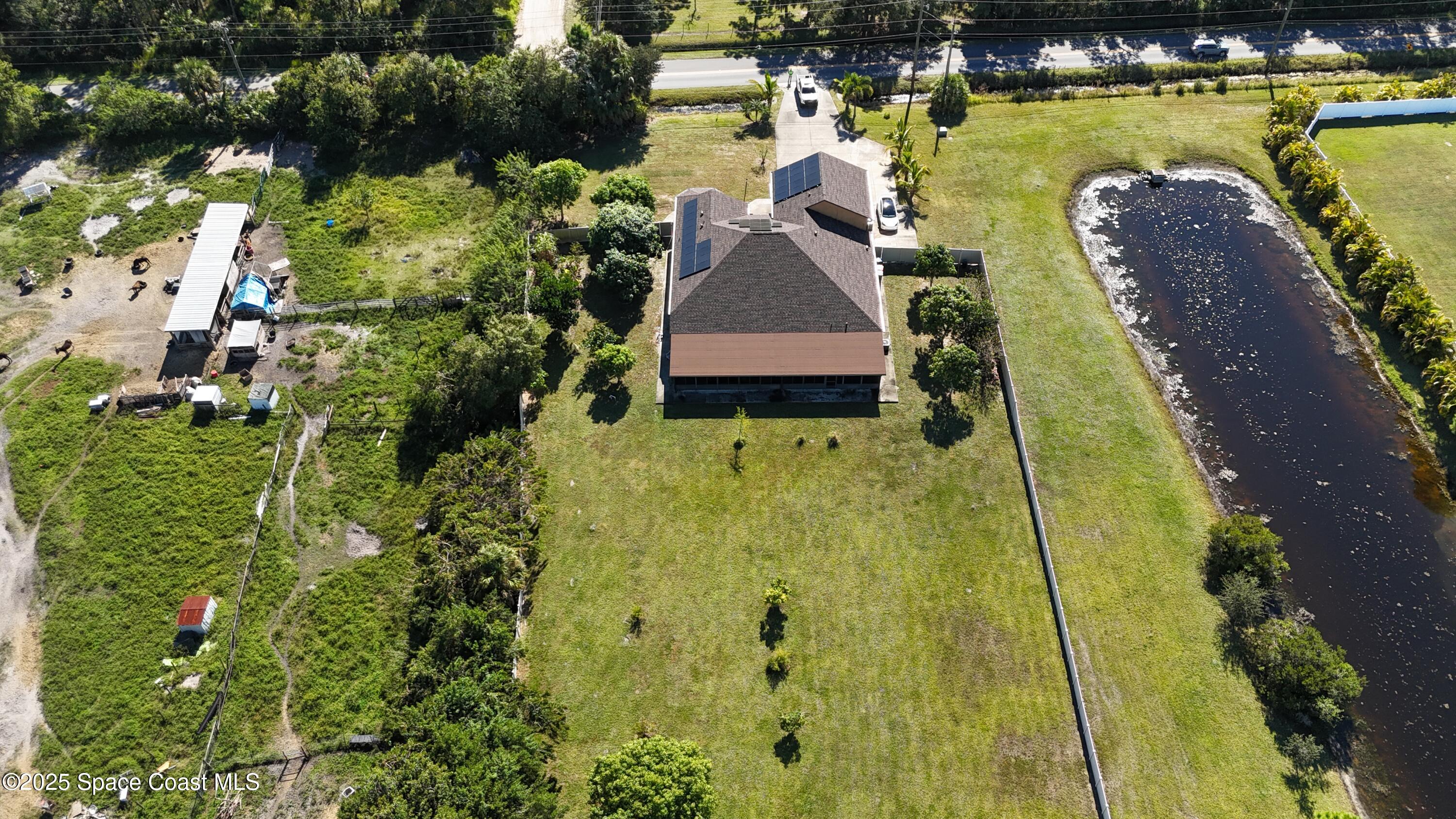 900 Hall Road Malabar, FL 32950 - Photo 28 of 28 an aerial view of a house with a yard swimming pool and outdoor seating
