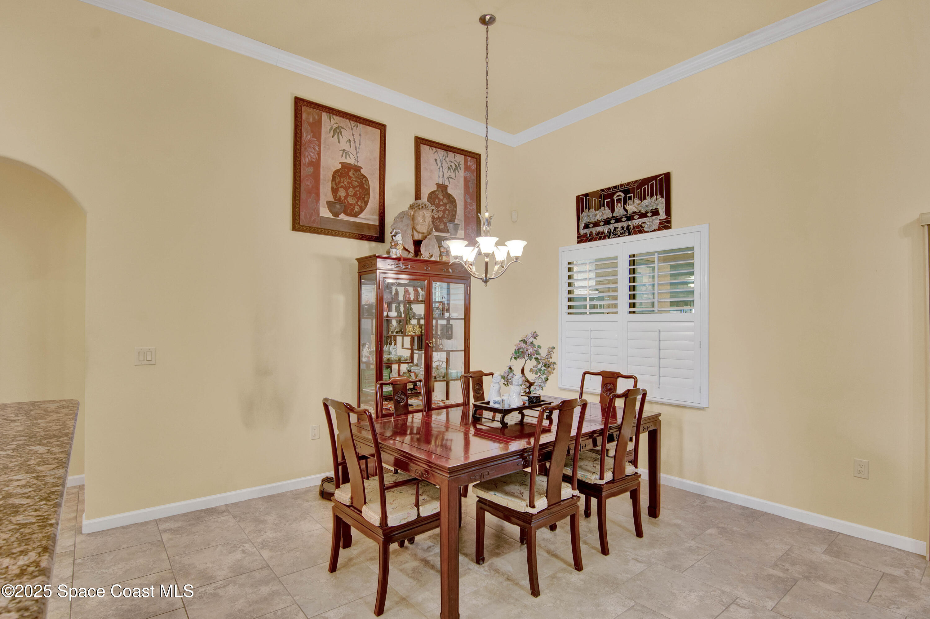 900 Hall Road Malabar, FL 32950 - Photo 6 of 28 a dining room with furniture and window