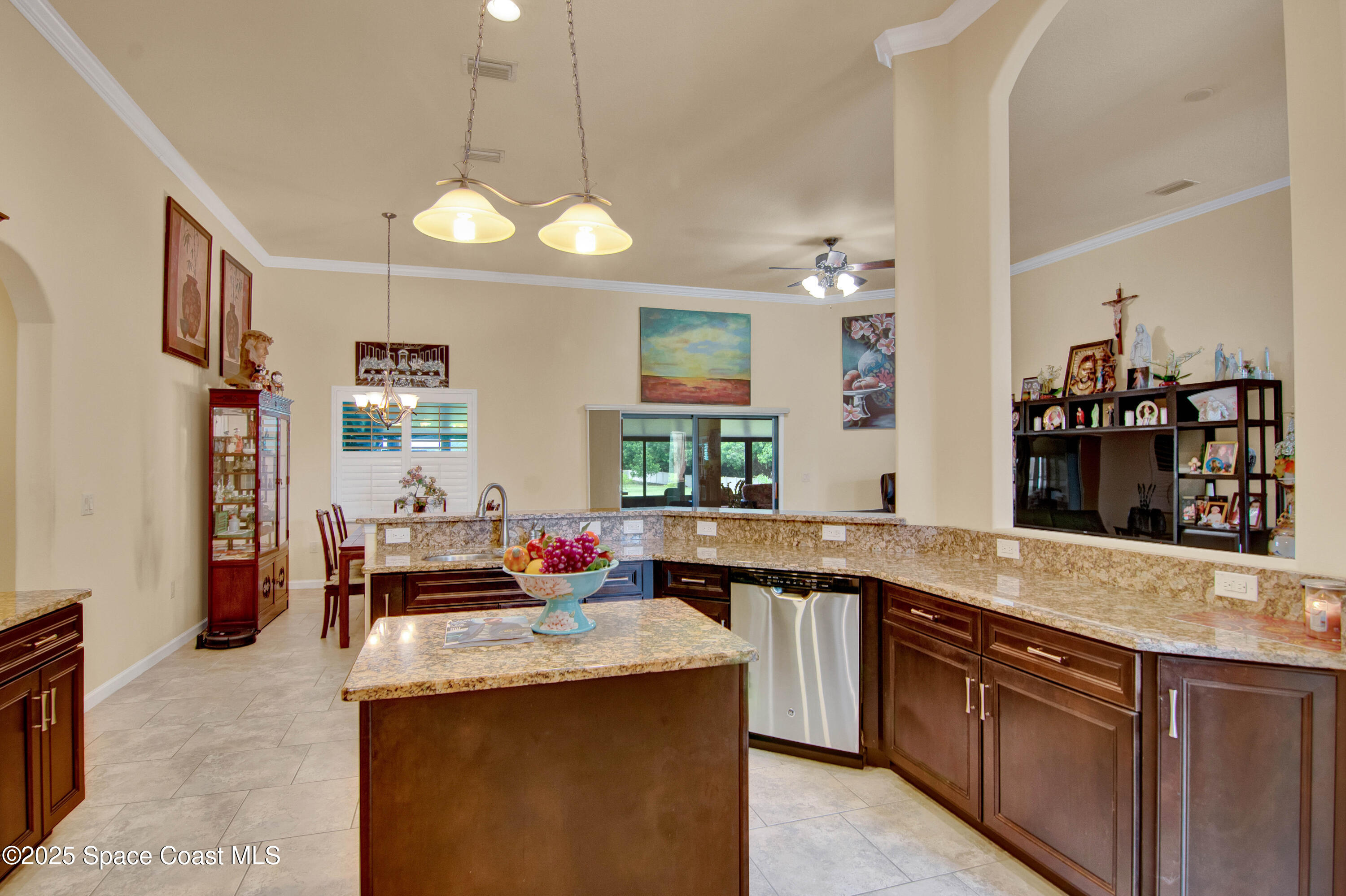 900 Hall Road Malabar, FL 32950 - Photo 10 of 28 a kitchen with stainless steel appliances granite countertop a sink and stove