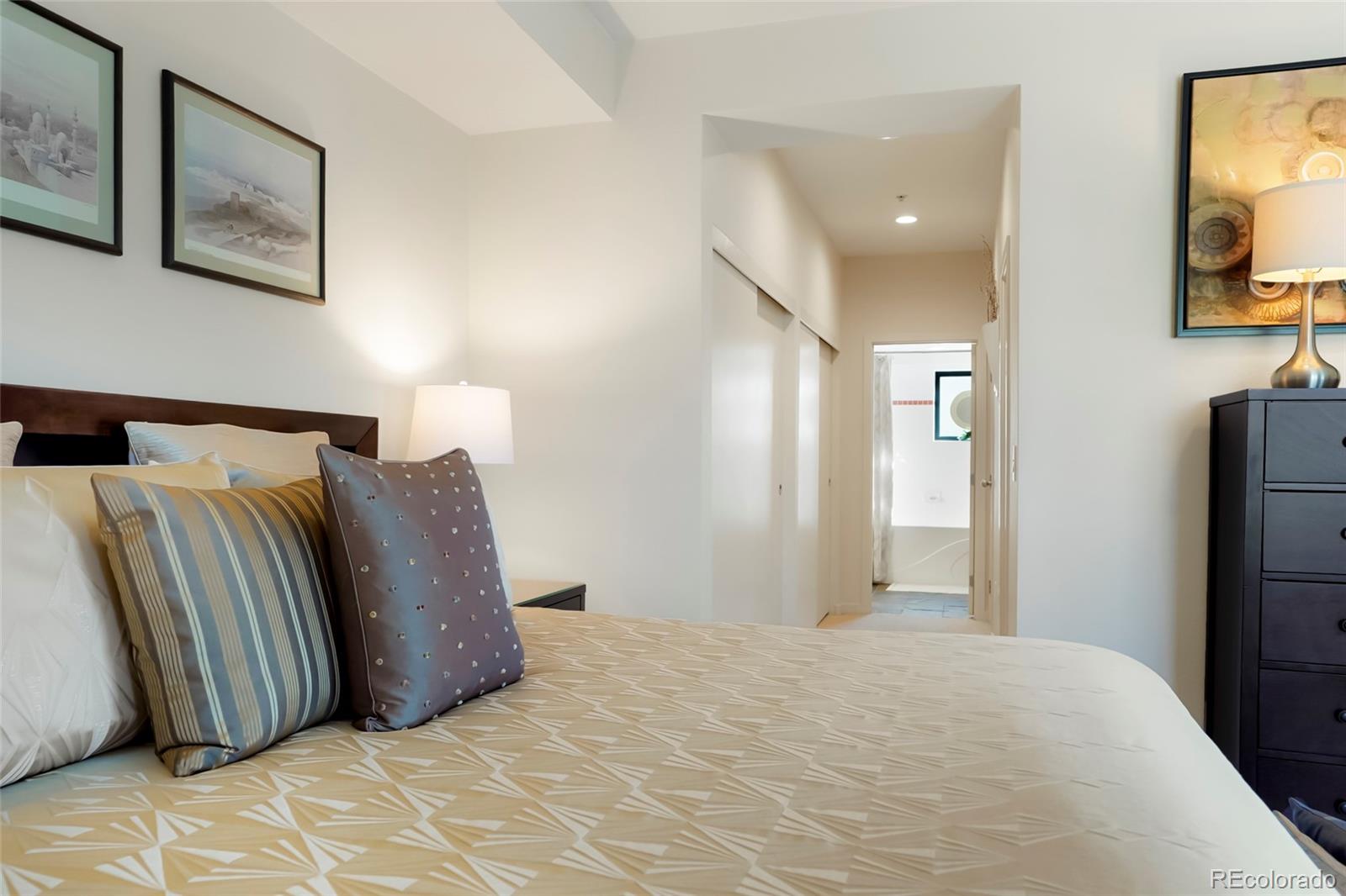 4520 Broadway, Unit 207 Boulder, CO 80304 - Photo 18 of 28 a bedroom with a bed and a flat screen tv