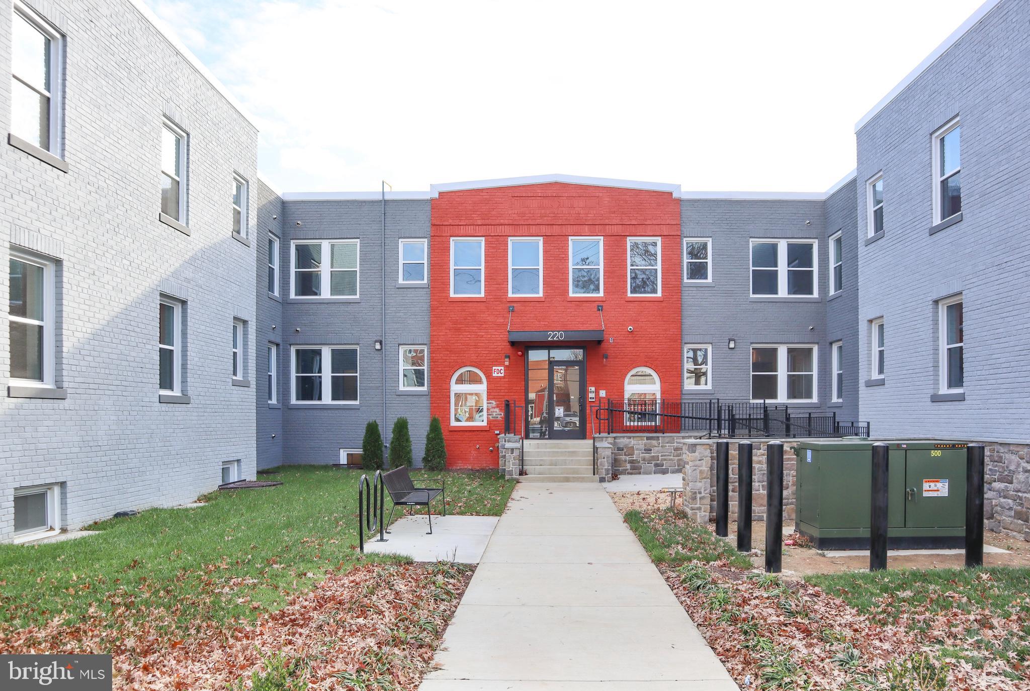 220 Hamilton Street Northwest, Unit 104 Washington, DC 20011 - Photo 1 of 11 a front view of a house with garden