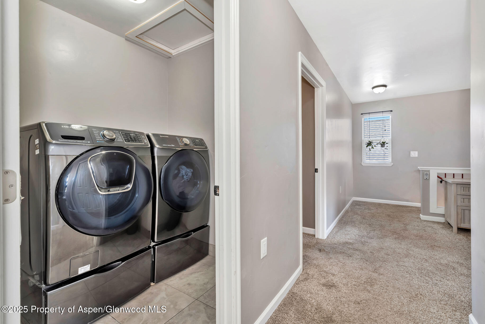 875 Dry Creek Road Hayden, CO 81639 - Photo 24 of 40 a view of a hallway with washer and dryer