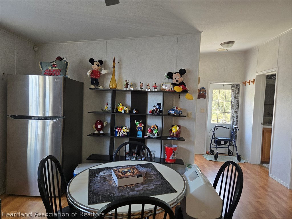504 Thunderbird Hill Road Sebring, FL 33872 - Photo 11 of 35 a dining room with furniture and window