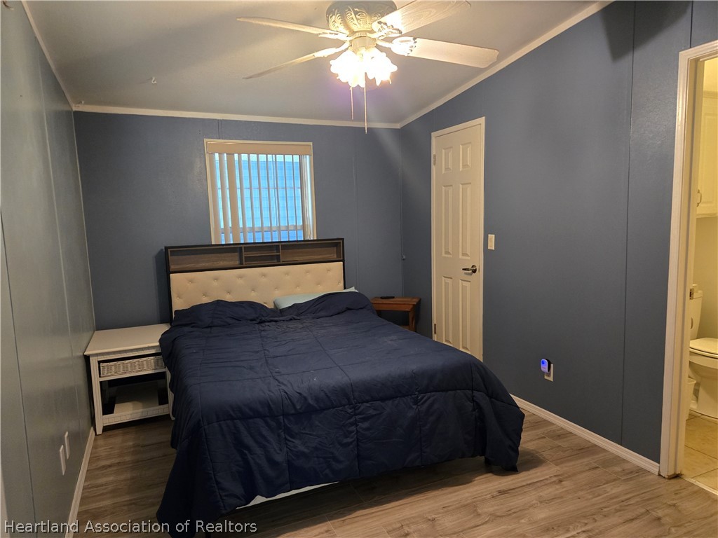 504 Thunderbird Hill Road Sebring, FL 33872 - Photo 19 of 35 a bedroom with a bed and window