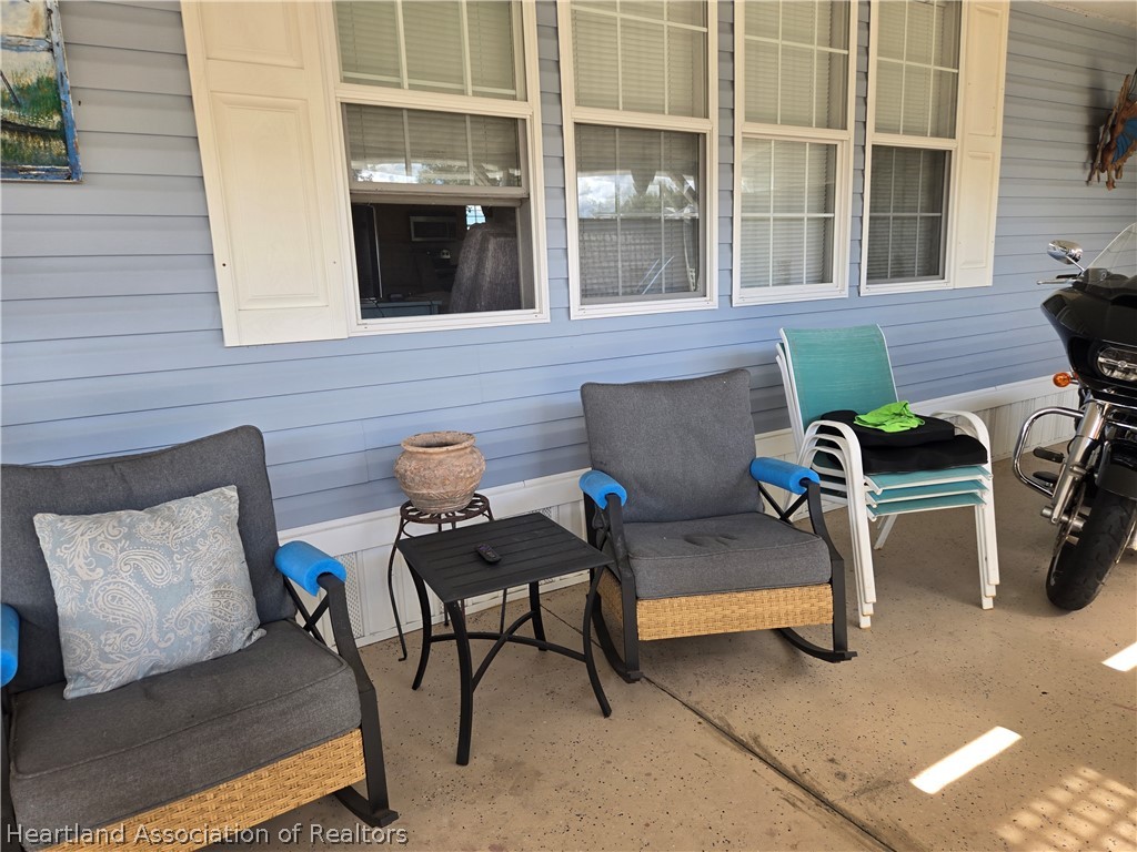 504 Thunderbird Hill Road Sebring, FL 33872 - Photo 5 of 35 a view of a lounge chairs in the patio
