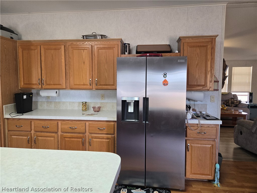504 Thunderbird Hill Road Sebring, FL 33872 - Photo 9 of 35 a kitchen with stainless steel appliances granite countertop a refrigerator a stove a sink and dishwasher