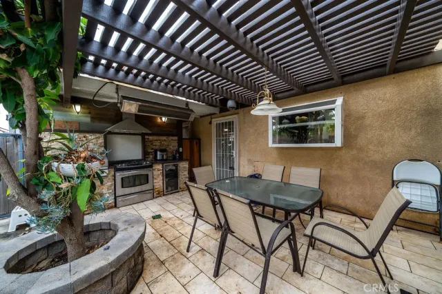 a view of a chairs and table in a patio