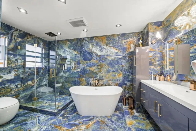 a spacious bathroom with a bathtub and shower