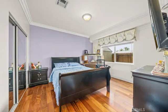 a bed room with a bed and a window