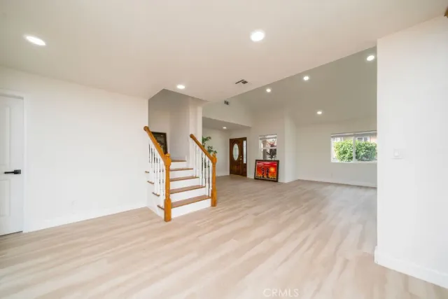 a view of a hallway with stairs