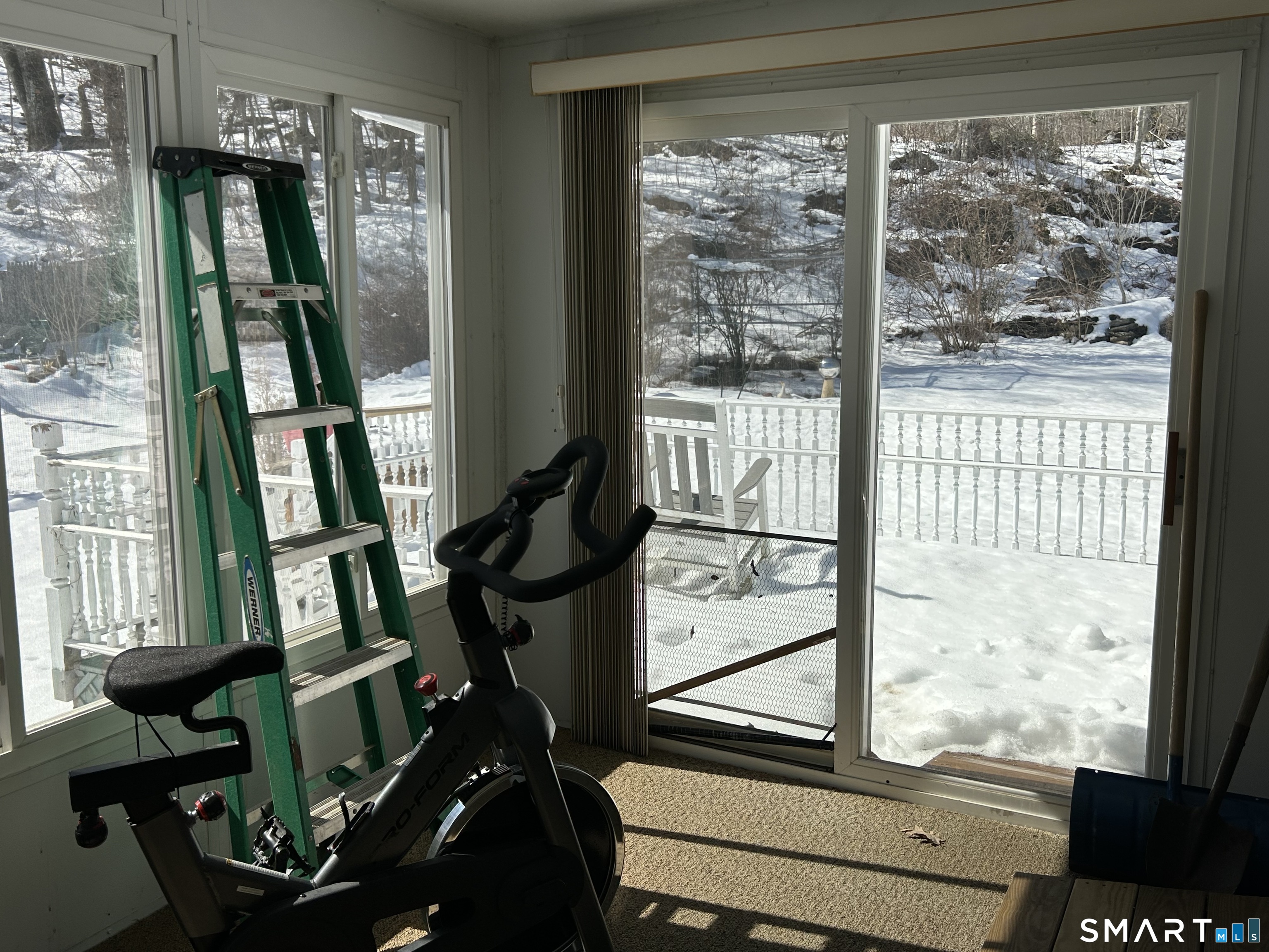 783 Buddington Road Groton, CT 06340 - Photo 14 of 35 a view of a living room with furniture and large windows
