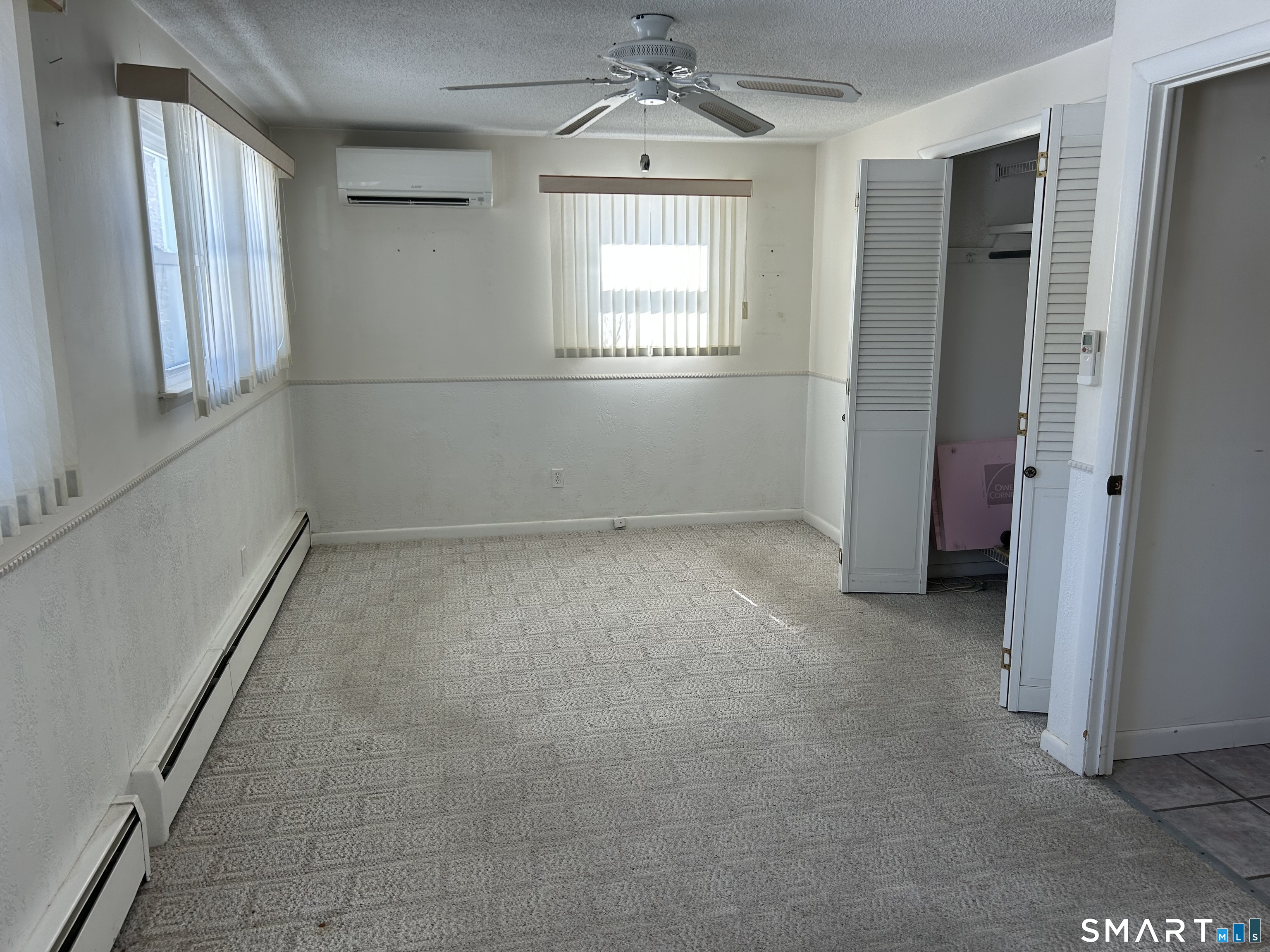 783 Buddington Road Groton, CT 06340 - Photo 15 of 35 an empty room with windows and entrance