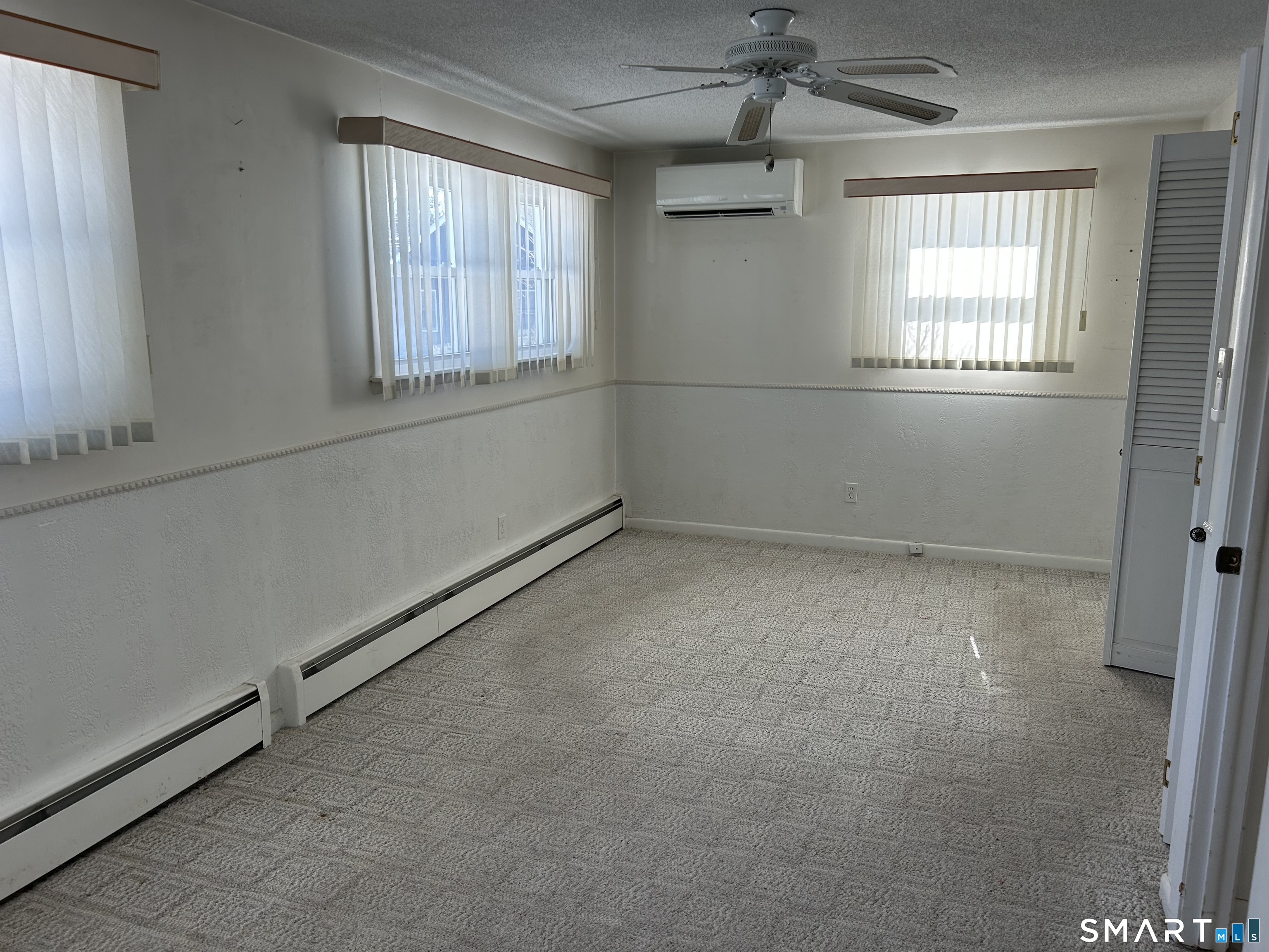 783 Buddington Road Groton, CT 06340 - Photo 16 of 35 a view of an empty room with a window