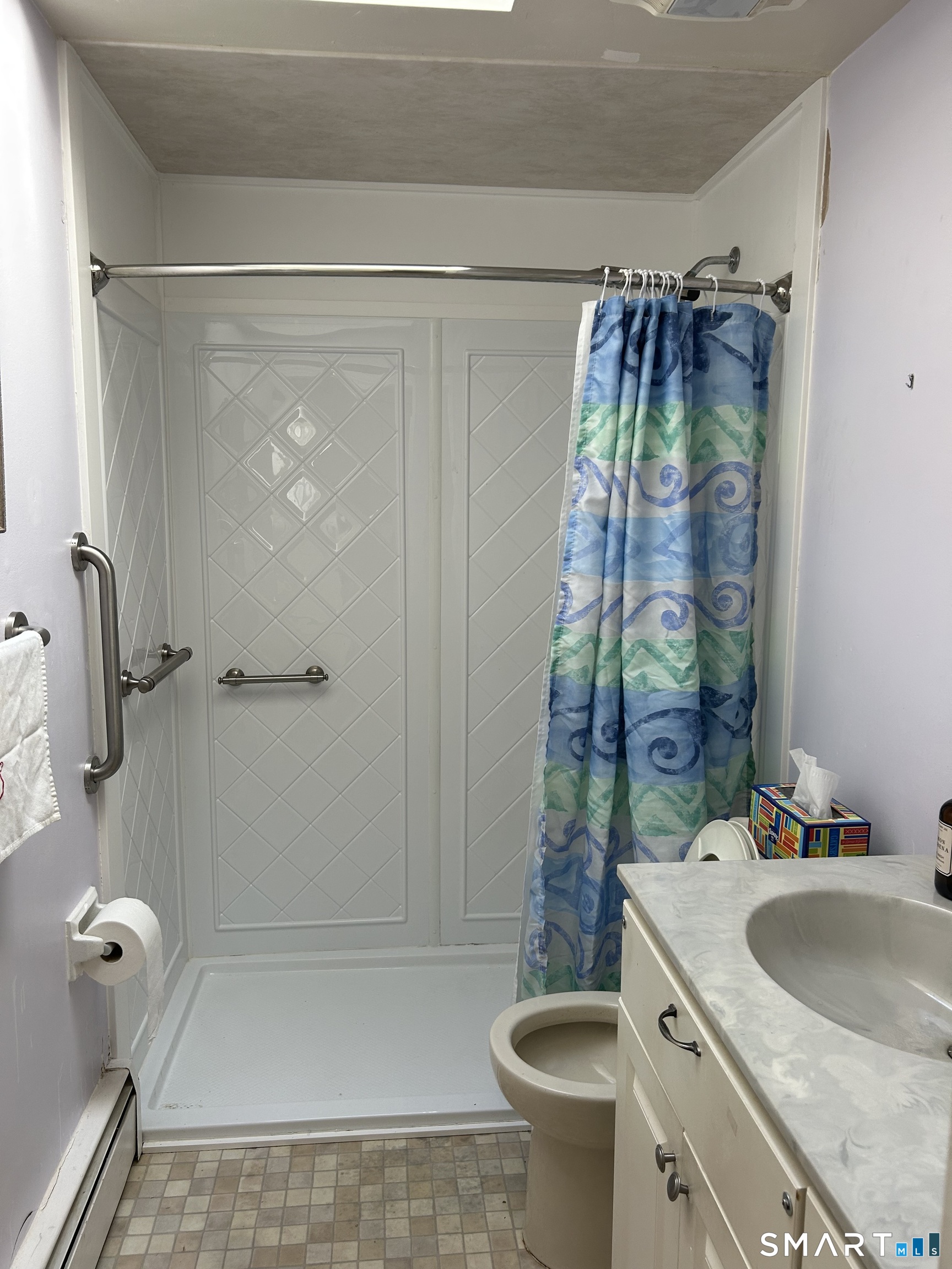 783 Buddington Road Groton, CT 06340 - Photo 18 of 35 a bathroom with a sink toilet and shower