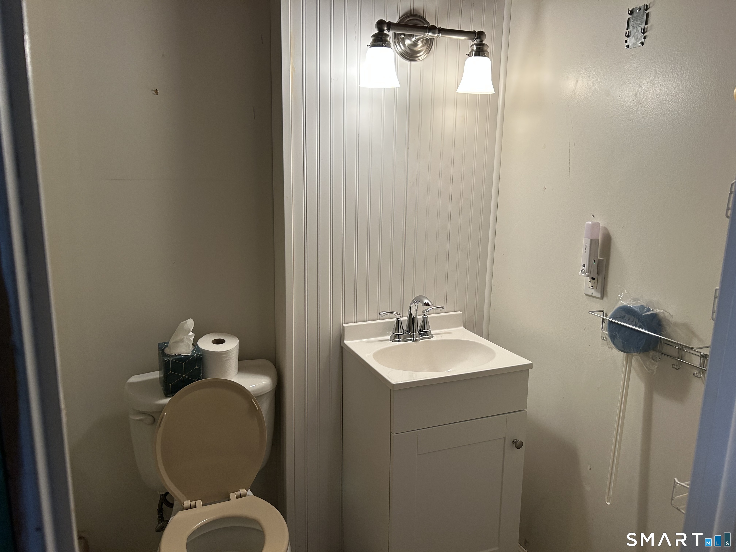 783 Buddington Road Groton, CT 06340 - Photo 23 of 35 a bathroom with a toilet sink and mirror