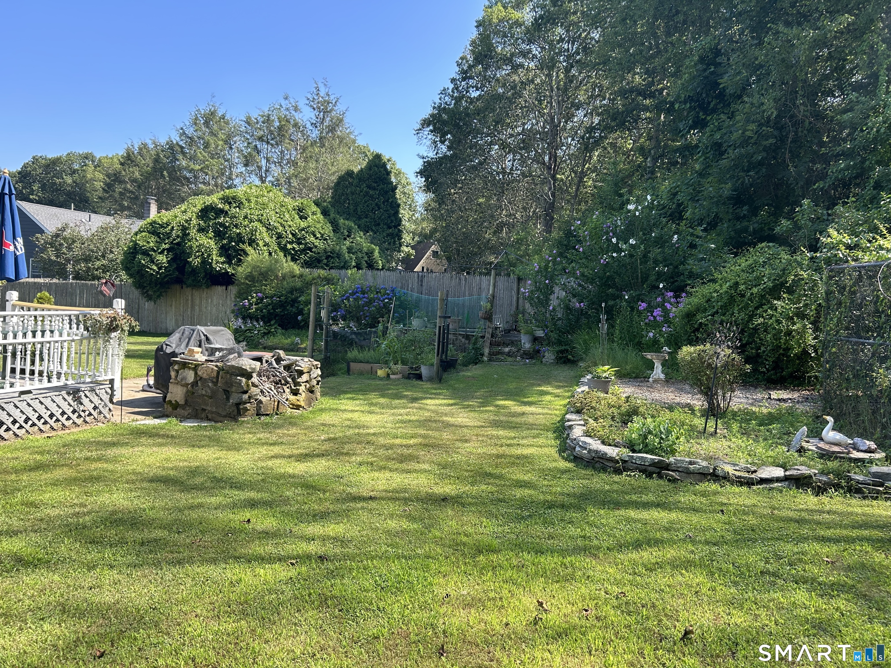 783 Buddington Road Groton, CT 06340 - Photo 31 of 35 a view of a chair and table on the garden