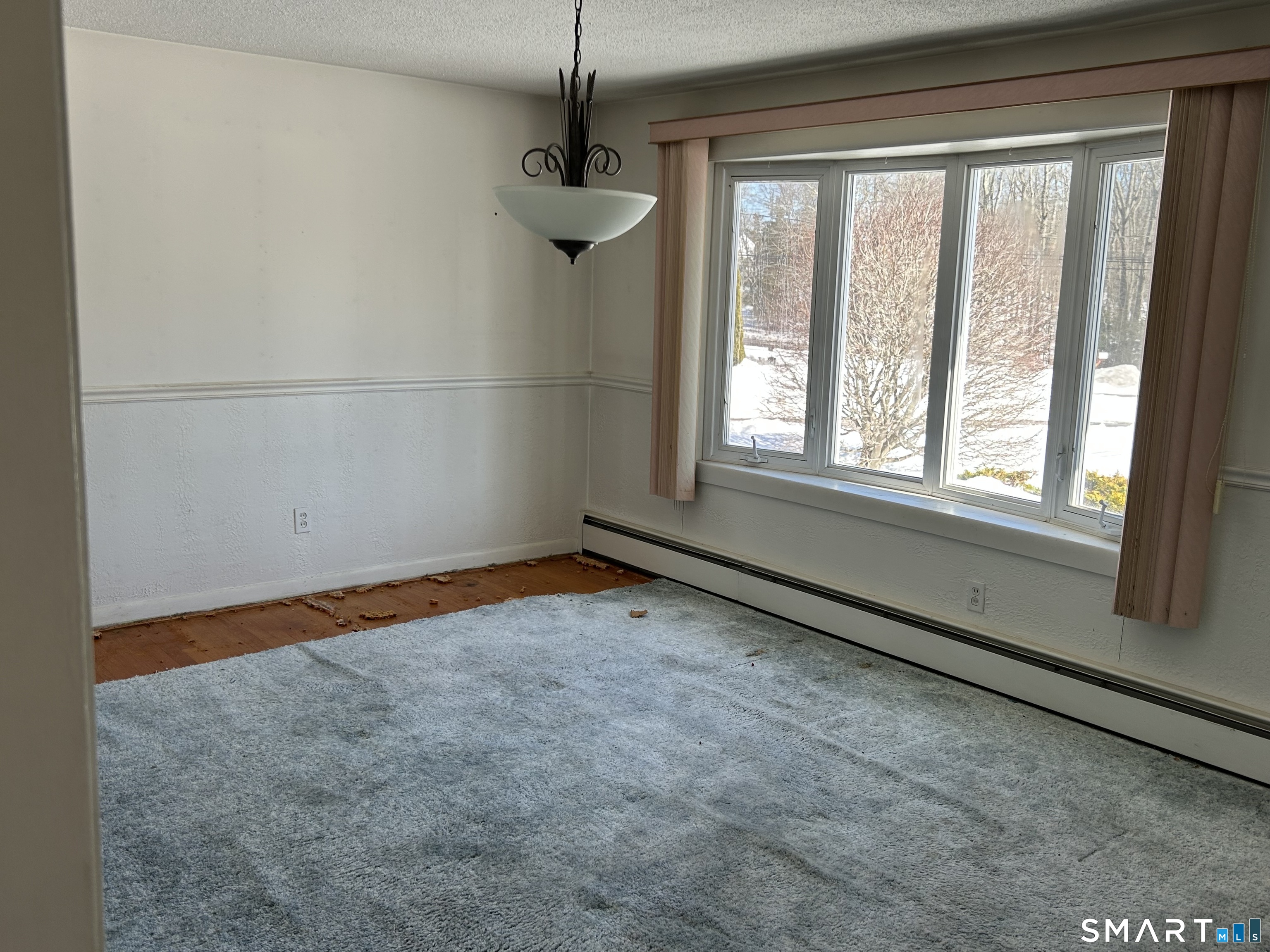783 Buddington Road Groton, CT 06340 - Photo 6 of 35 a view of an empty room with a window