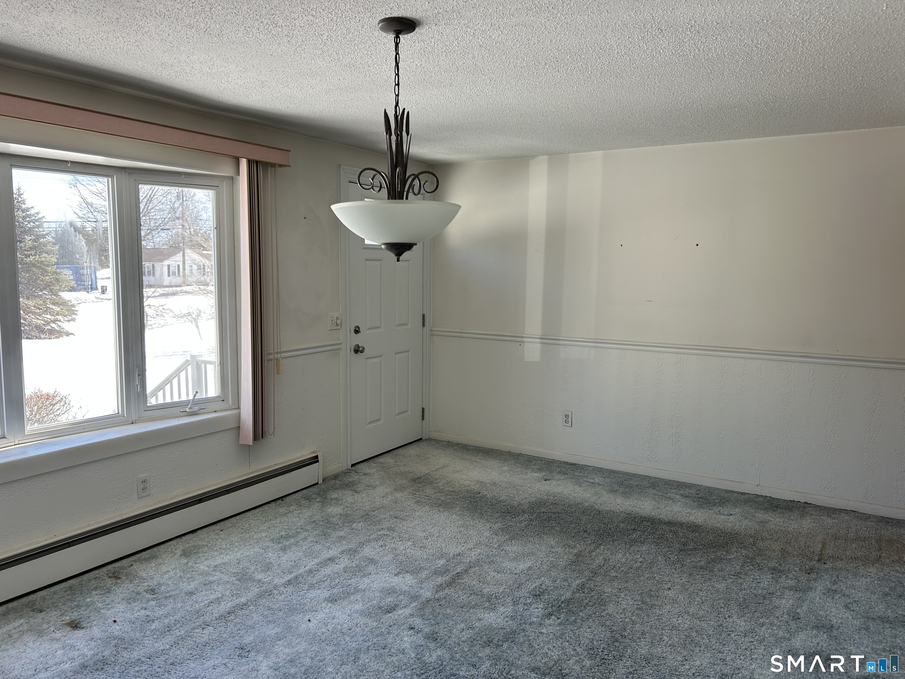 783 Buddington Road Groton, CT 06340 - Photo 7 of 35 a view of an empty room with a window