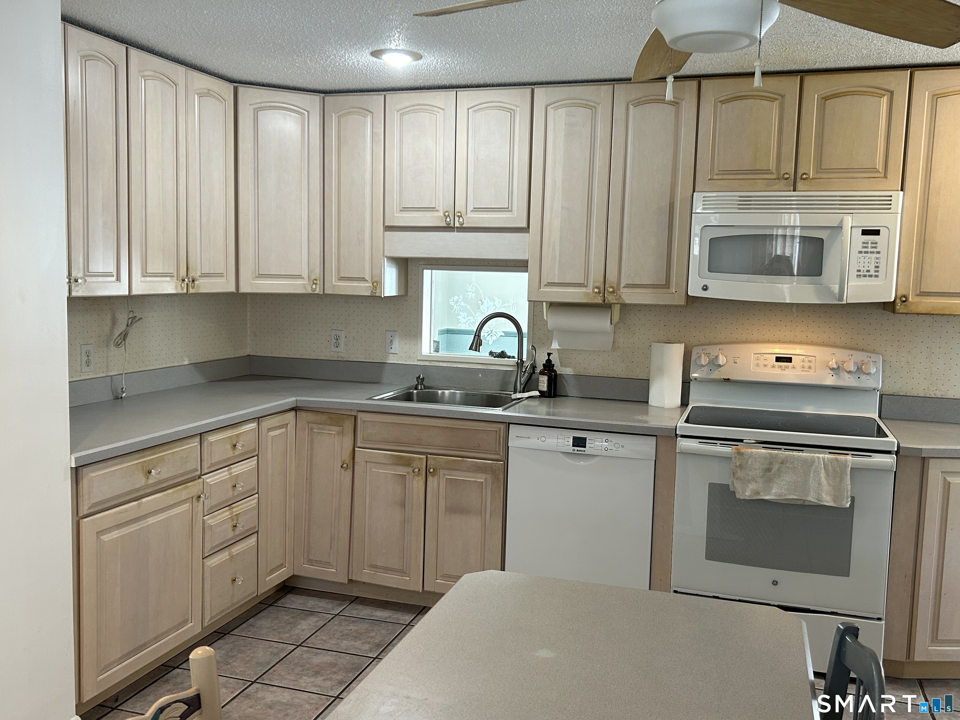 783 Buddington Road Groton, CT 06340 - Photo 8 of 35 a kitchen with stainless steel appliances granite countertop a sink a stove and cabinets
