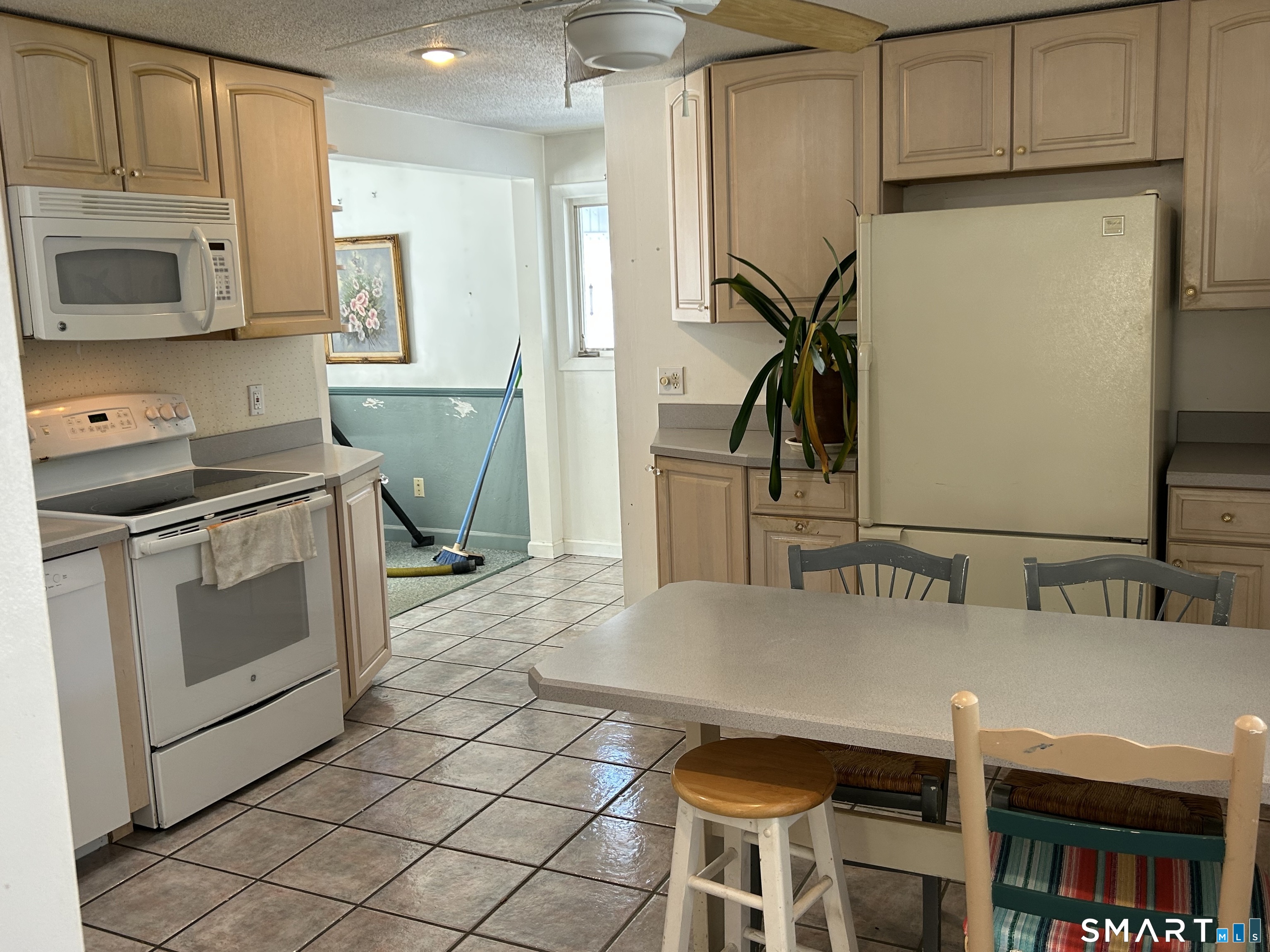 783 Buddington Road Groton, CT 06340 - Photo 9 of 35 a kitchen with a sink appliances and cabinets