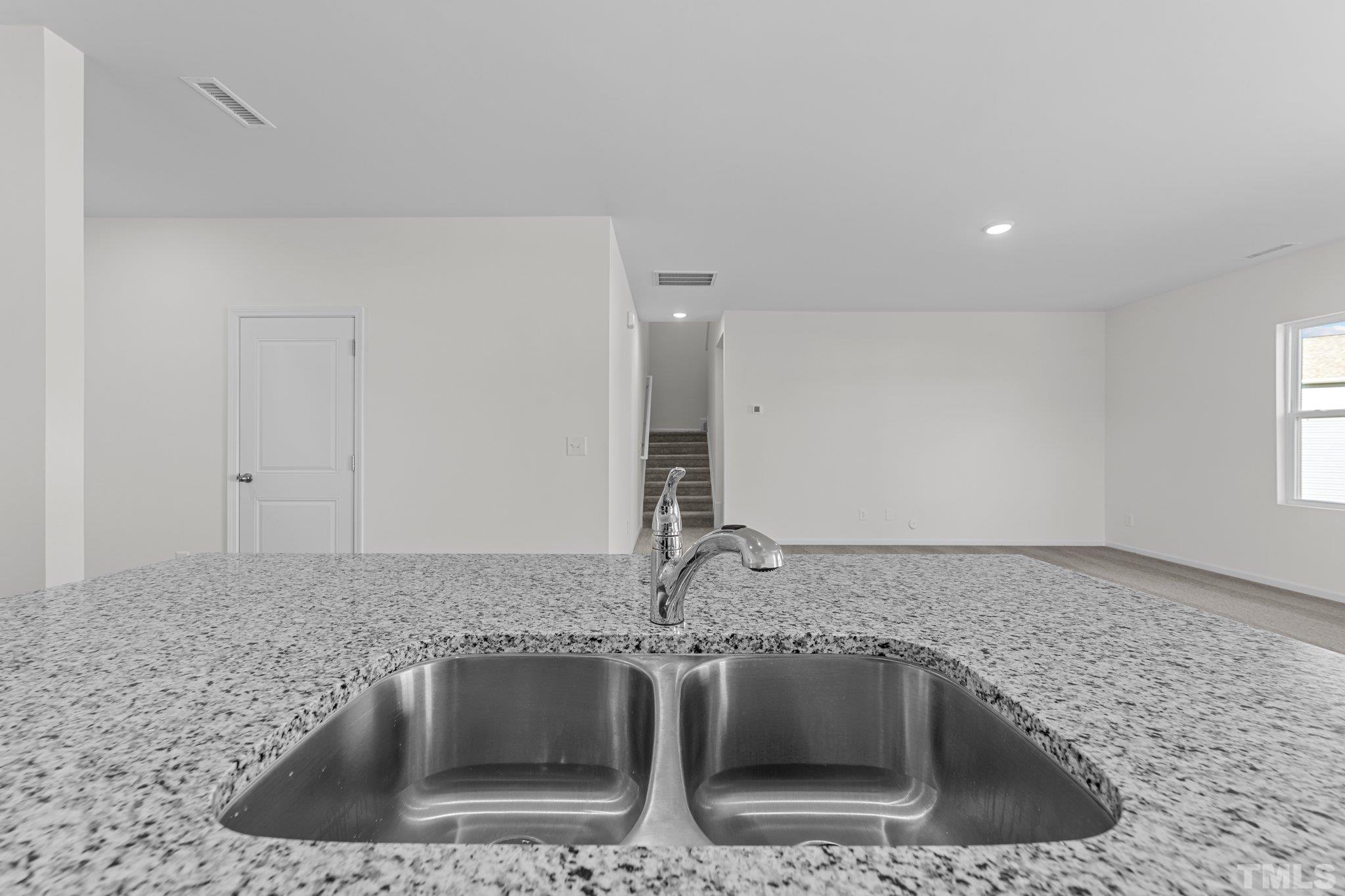200 Miles Drive Pikeville, NC 27863 - Photo 11 of 34 a kitchen with a sink and granite top