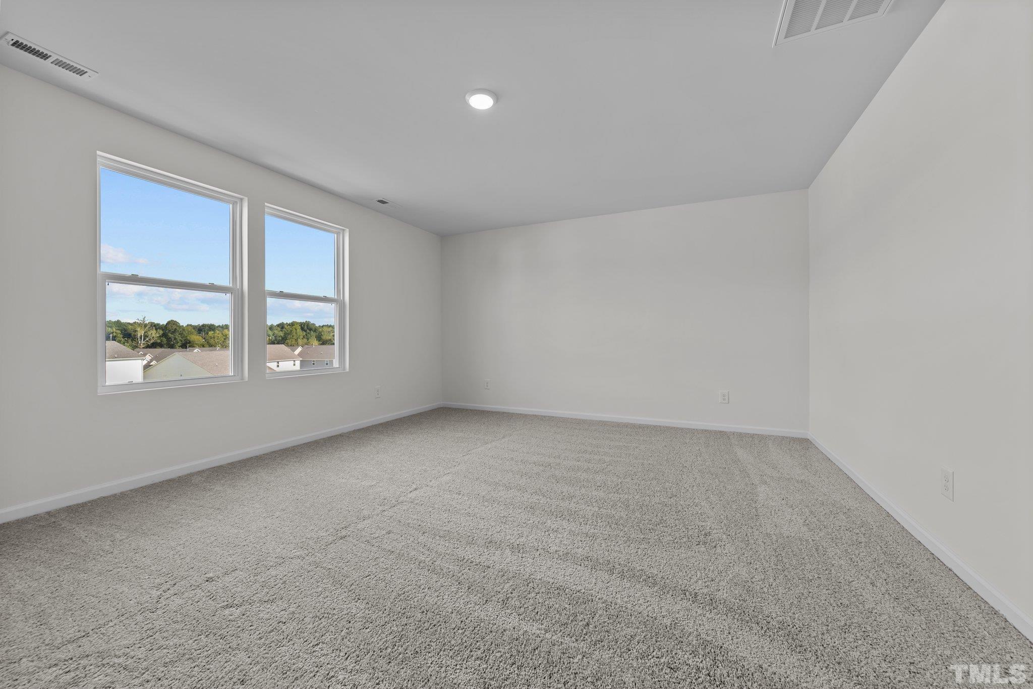 200 Miles Drive Pikeville, NC 27863 - Photo 21 of 34 an empty room with windows