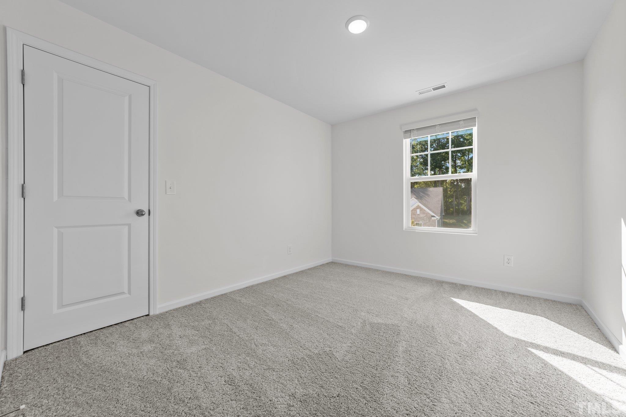 200 Miles Drive Pikeville, NC 27863 - Photo 28 of 34 an empty room with windows