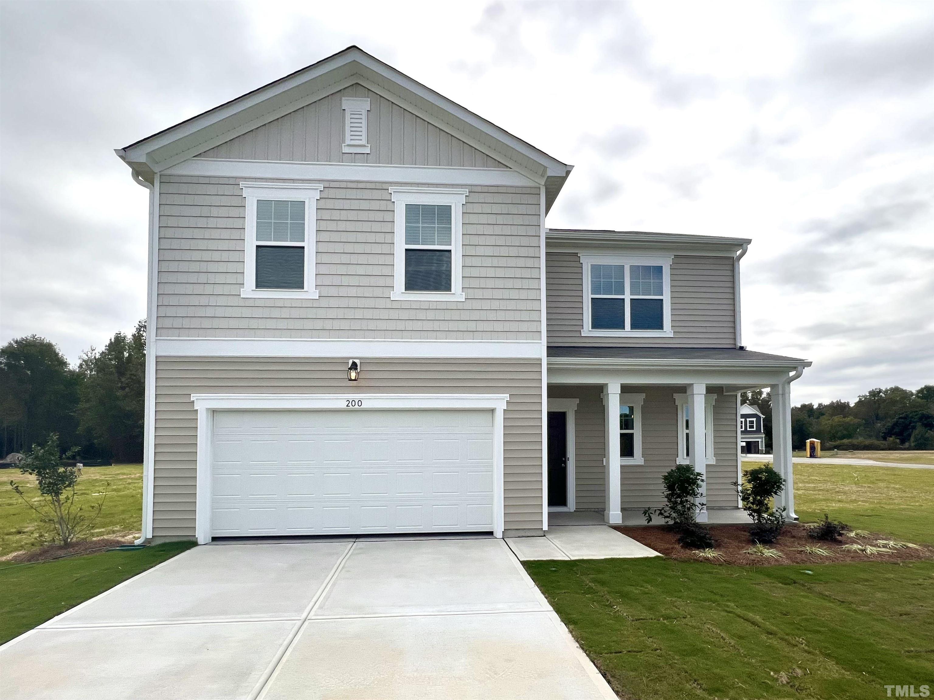 200 Miles Drive Pikeville, NC 27863 - Photo 3 of 34 a front view of a house with a yard
