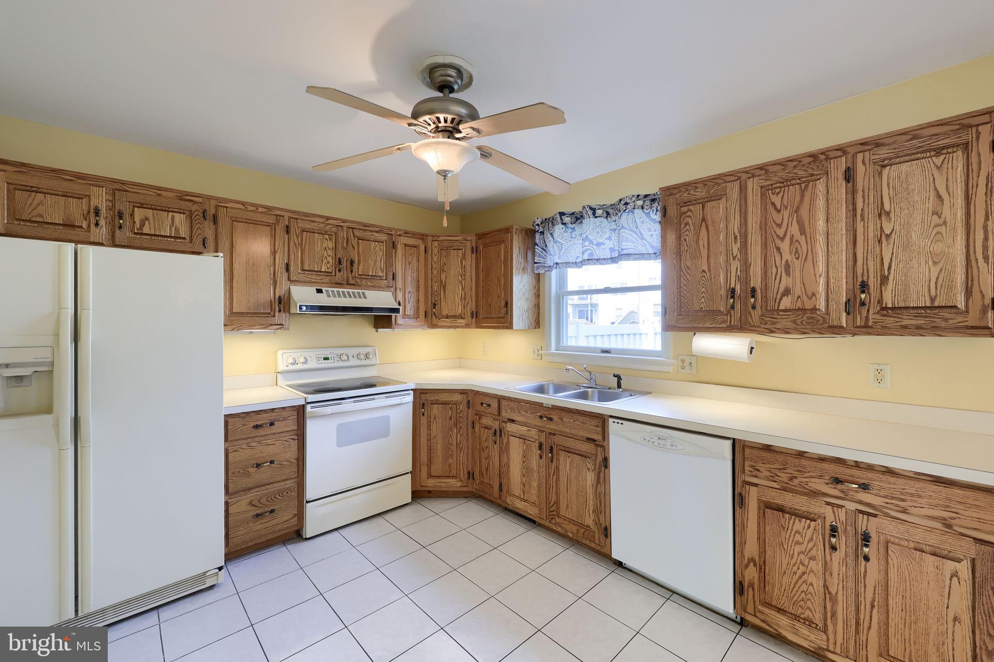 142 Palm Lane Lebanon, PA 17042 - Photo 16 of 38 a kitchen with a sink window and cabinets