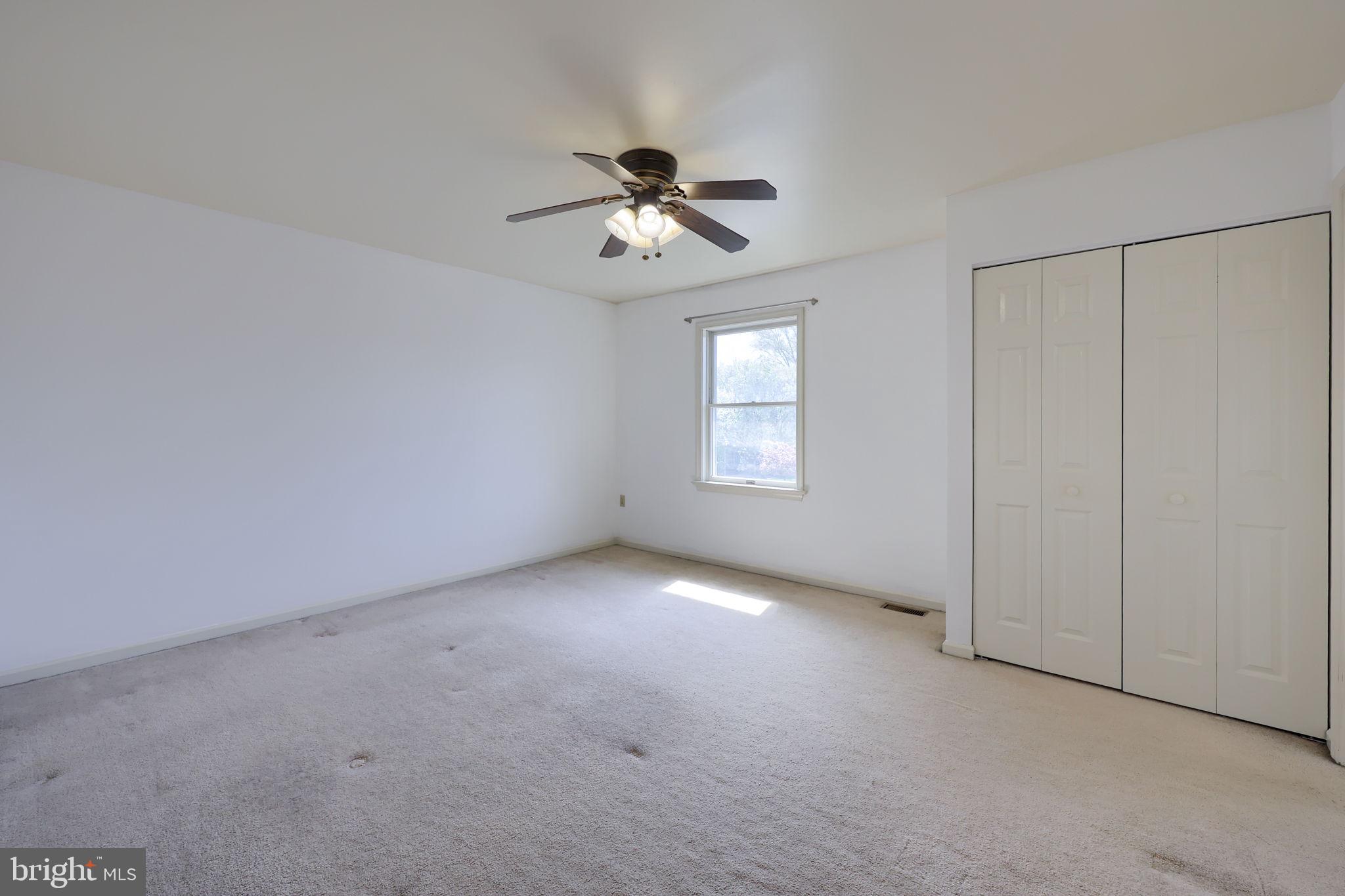 142 Palm Lane Lebanon, PA 17042 - Photo 28 of 38 an empty room with windows and fan chandelier fan