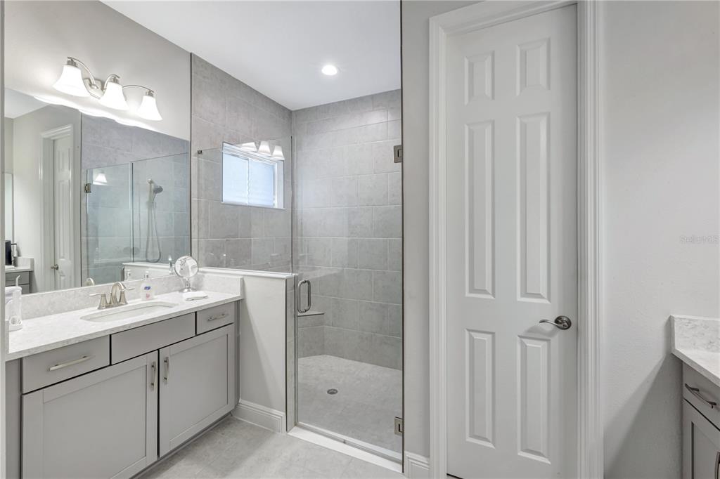 6219 Golden Nettle Drive Apollo Beach, FL 33572 - Photo 13 of 37 a bathroom with a double vanity sink and mirror