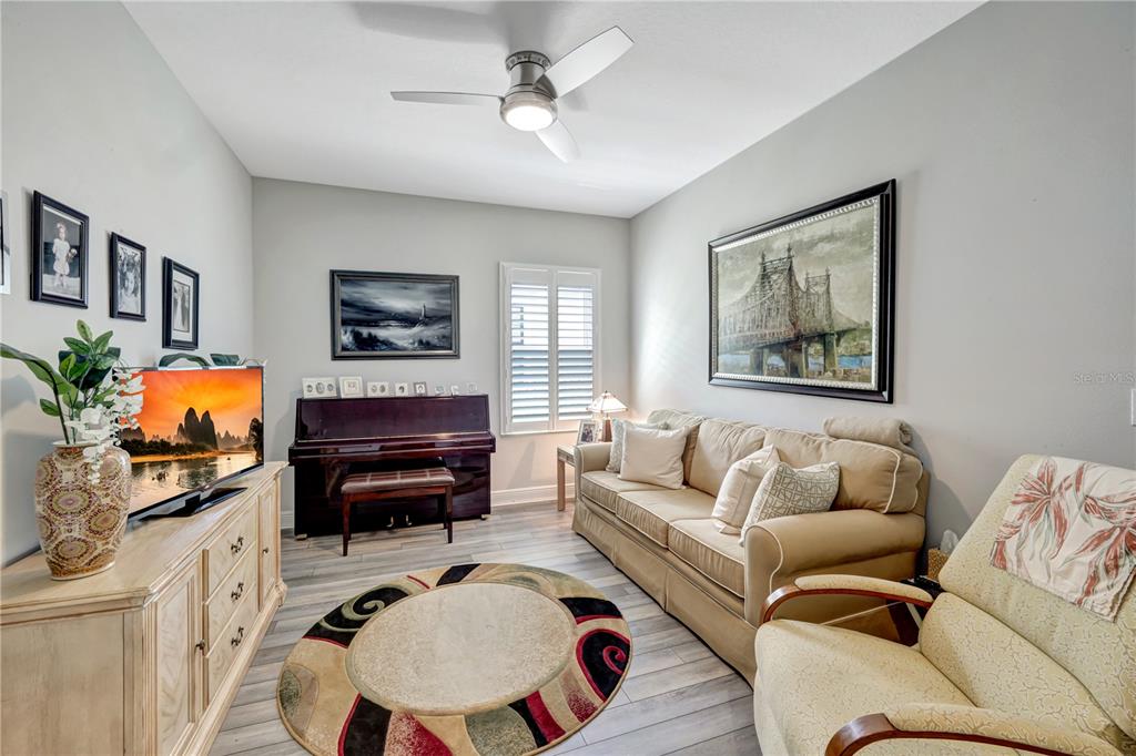 6219 Golden Nettle Drive Apollo Beach, FL 33572 - Photo 19 of 37 a living room with furniture and a flat screen tv