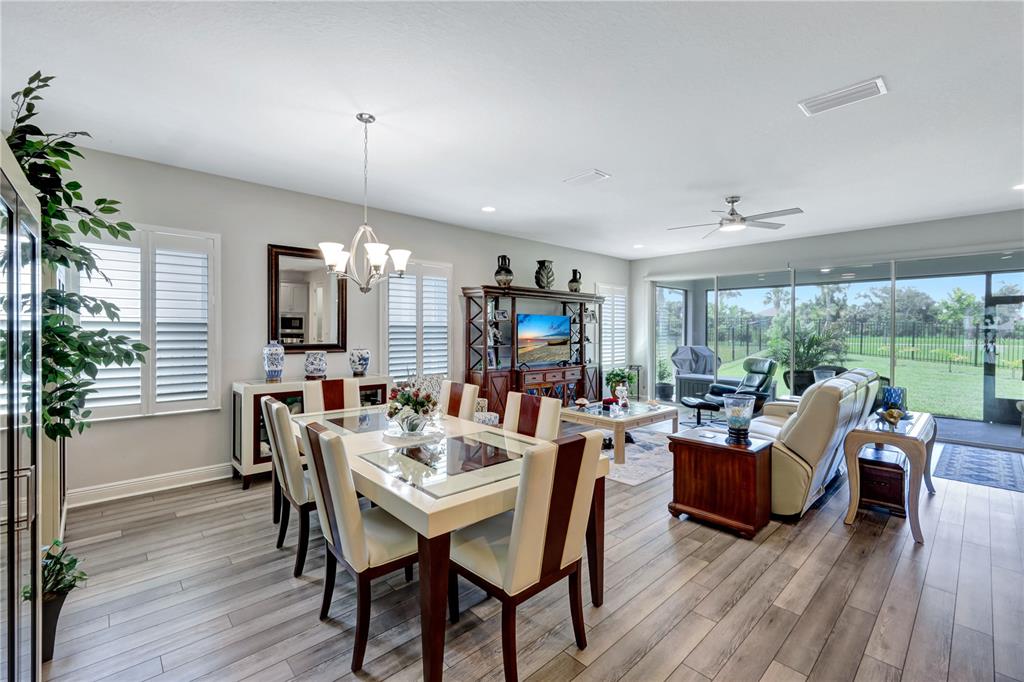 6219 Golden Nettle Drive Apollo Beach, FL 33572 - Photo 21 of 37 a view of a dining room with furniture window and wooden floor