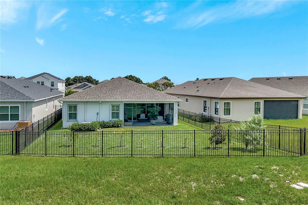 6219 Golden Nettle Drive Apollo Beach, FL 33572 - Photo 26 of 37 a view of a house with a big yard and potted plants and large tree