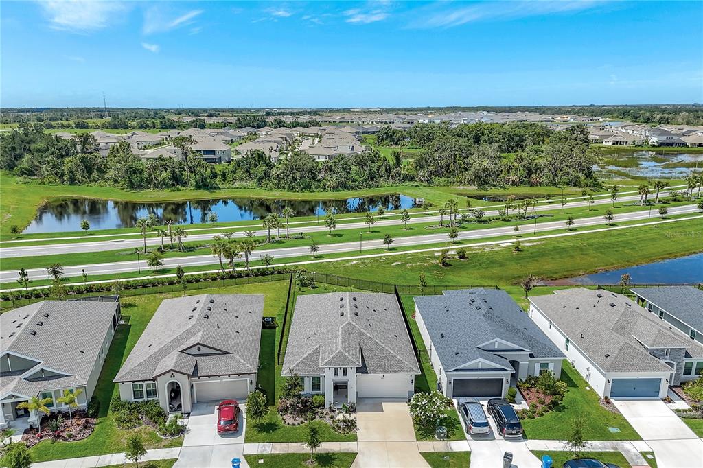 6219 Golden Nettle Drive Apollo Beach, FL 33572 - Photo 27 of 37 an aerial view of a houses with a yard and lake view