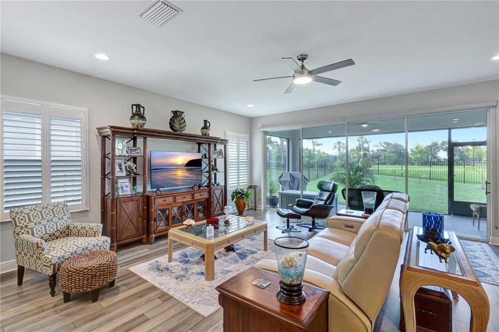 6219 Golden Nettle Drive Apollo Beach, FL 33572 - Photo 9 of 37 a living room with furniture and a flat screen tv