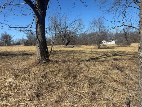 a view of snow on the side of a road