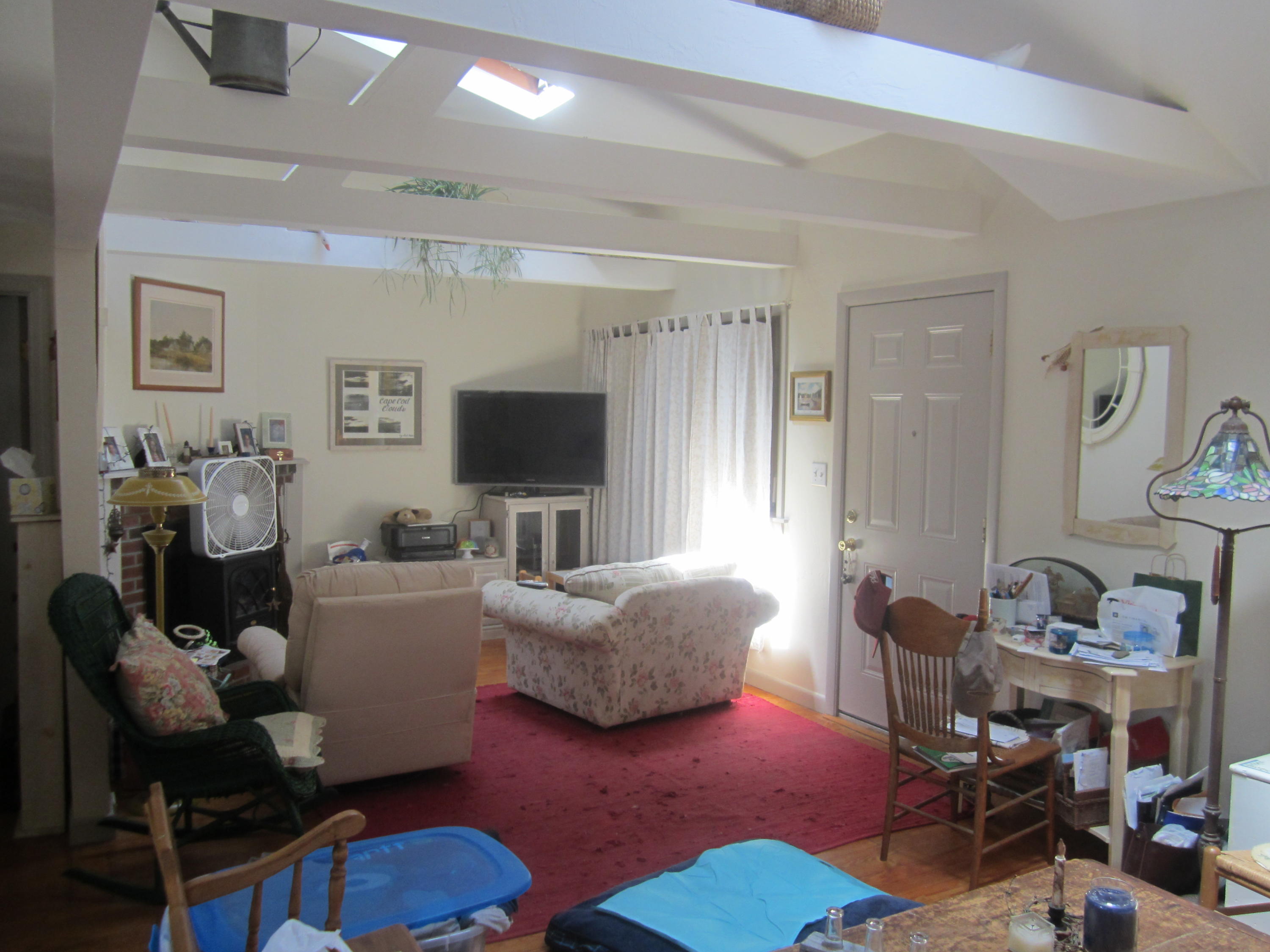 101 Lower County Road, Unit U1A Dennis Port, MA 02639 - Photo 6 of 10 a living room with furniture and a flat screen tv