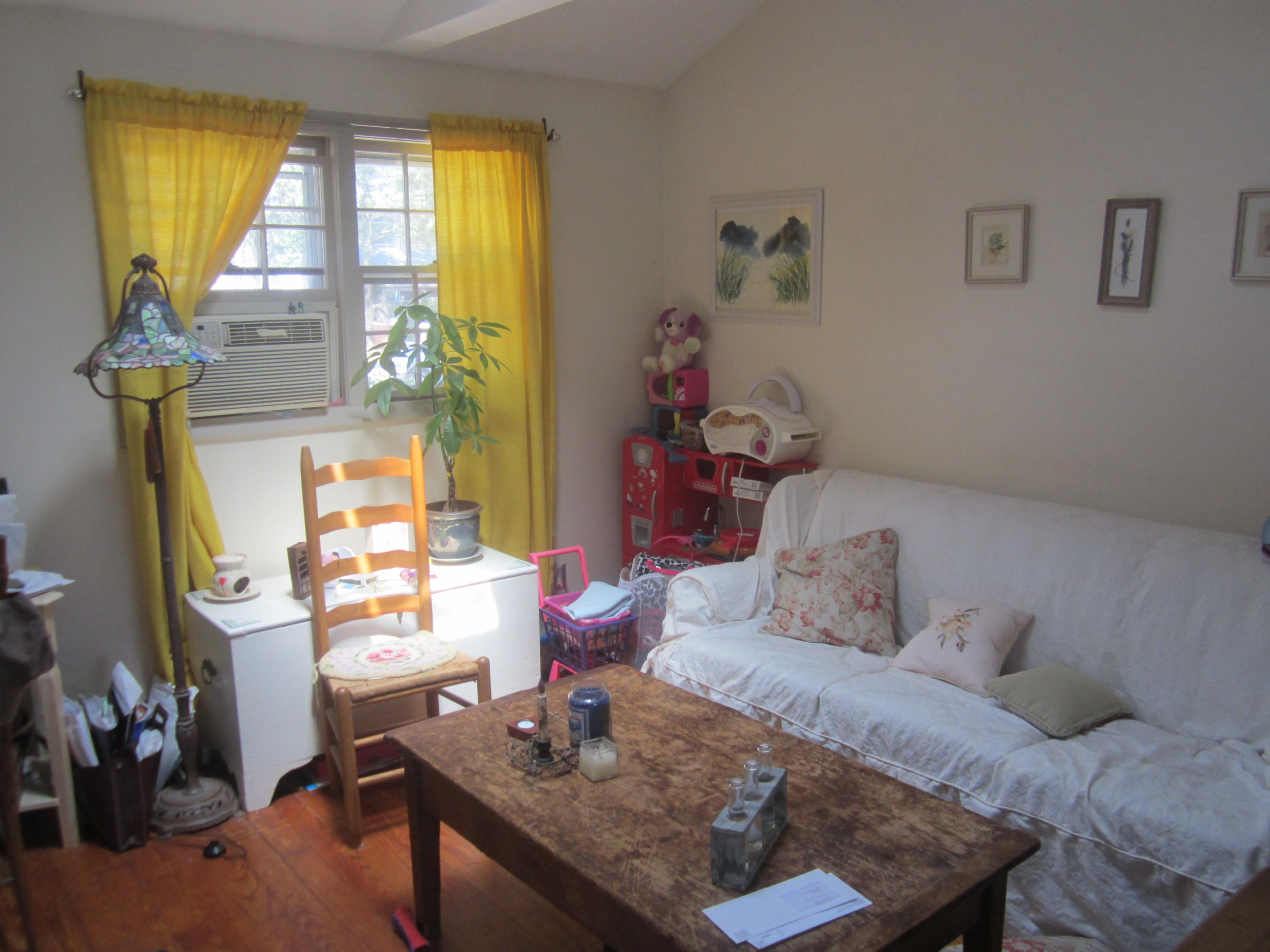 101 Lower County Road, Unit U1A Dennis Port, MA 02639 - Photo 8 of 10 a bedroom with a bed and a table