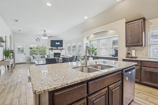 a kitchen with granite countertop a sink and center island